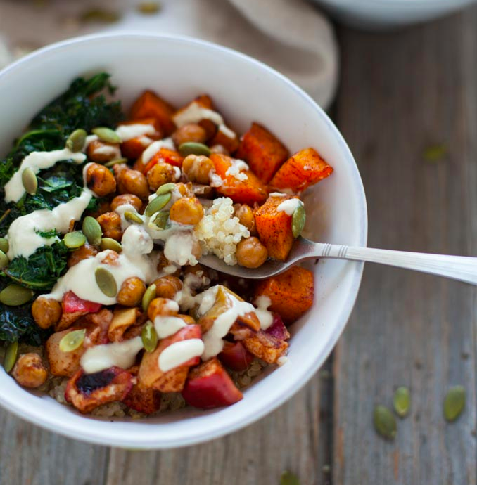 cashews, chickpeas, couscous, and veggies in a bowl