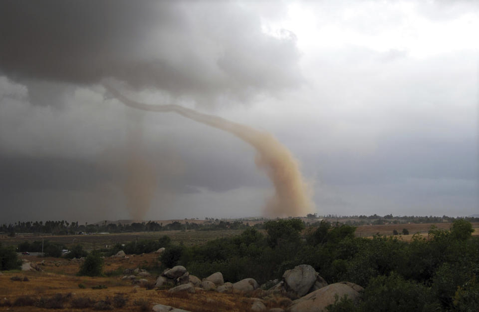 FILE - In this Thursday, May 22, 2008, file photo, a tornado touches down in Riverside, Calif. On Tuesday, Jan. 10, 2017, a twister touched down south of the state capital and registered EF0, at the lowest edge of the tornado scale that goes up to EF5. The Enhanced Fujita (EF) scale measures the intensity of tornadoes in the U.S. and Canada based on damage caused. (AP Photo/Michael Ritter, File)