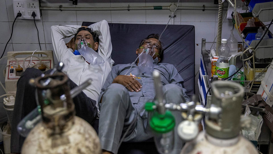 Patients suffering from the coronavirus receive treatment at the casualty ward in Lok Nayak Jai Prakash hospital in New Delhi, India, April 15. Many Indian hospitals are scrambling for beds and oxygen as COVID-19 infections surge to new daily records. 