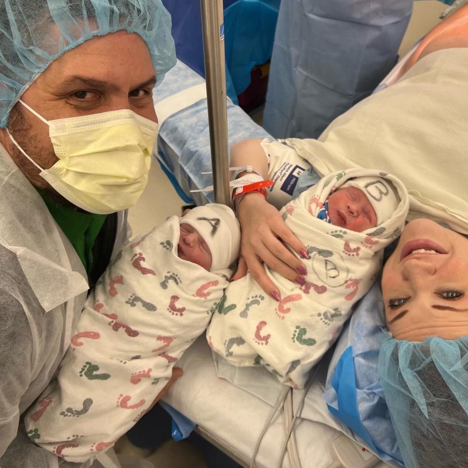 Cliff Scott, at left, and Kali Scott, at right, of Denton, Texas, with their twins, Annie Jo, who was born on Dec. 31, 2022, and Effie Rose,  who was born a few minutes later at 12:01 a.m. Jan. 1, 2023 at Texas Health Presbyterian Hospital Denton.