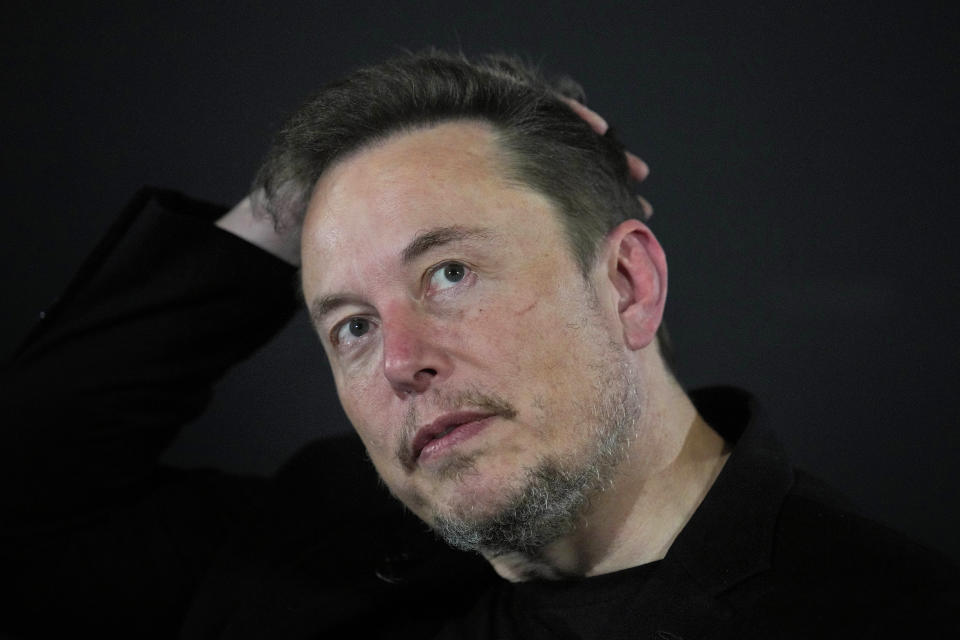 FILE - Elon Musk appears at an event with Britain's Prime Minister Rishi Sunak in London, on Nov. 2, 2023. Musk is suing OpenAI and its CEO Sam Altman over what he says is a betrayal of the ChatGPT maker's founding aims of benefiting humanity rather than pursuing profits. In a lawsuit filed Thursday Feb. 29, 2024 at San Francisco Superior Court, billionaire Musk said that when he bankrolled OpenAI's creation, he secured an agreement with Altman and Greg Brockman, the president, to keep the AI company as a non-profit that would develop technology for the benefit of the public. (AP Photo/Kirsty Wigglesworth, Pool, File)