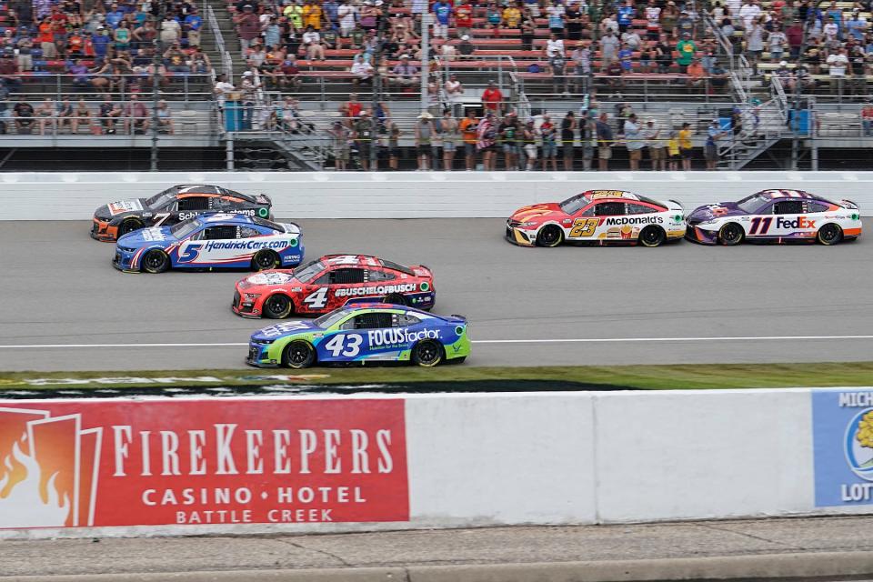 Corey Lajoie (7), Kyle Larson (5), Kevin Harvick (4), Erik Jones (43), Bubba Wallace (23) and Denny Hamlin (11) race during Sunday's Firekeepers Casino 400 at Michigan International Speedway.