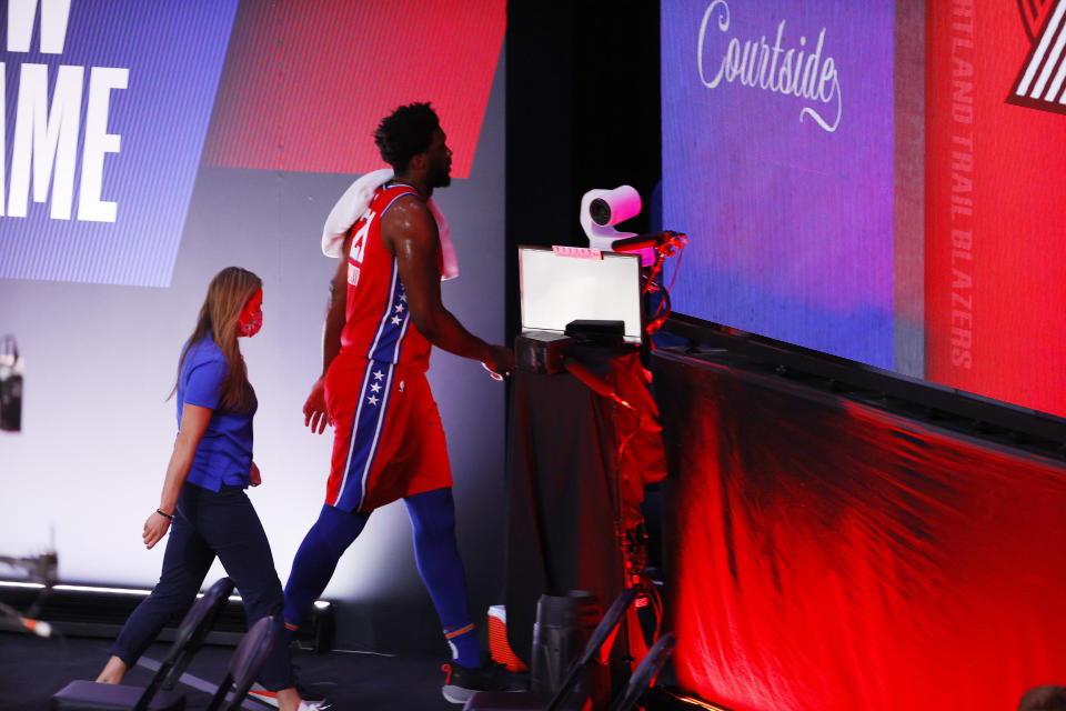 Philadelphia 76ers' Joel Embiid (21) leaves an NBA basketball game against the Portland Trail Blazers, Sunday, Aug. 9, 2020, in Lake Buena Vista, Fla. (Kevin C. Cox/Pool Photo via AP)