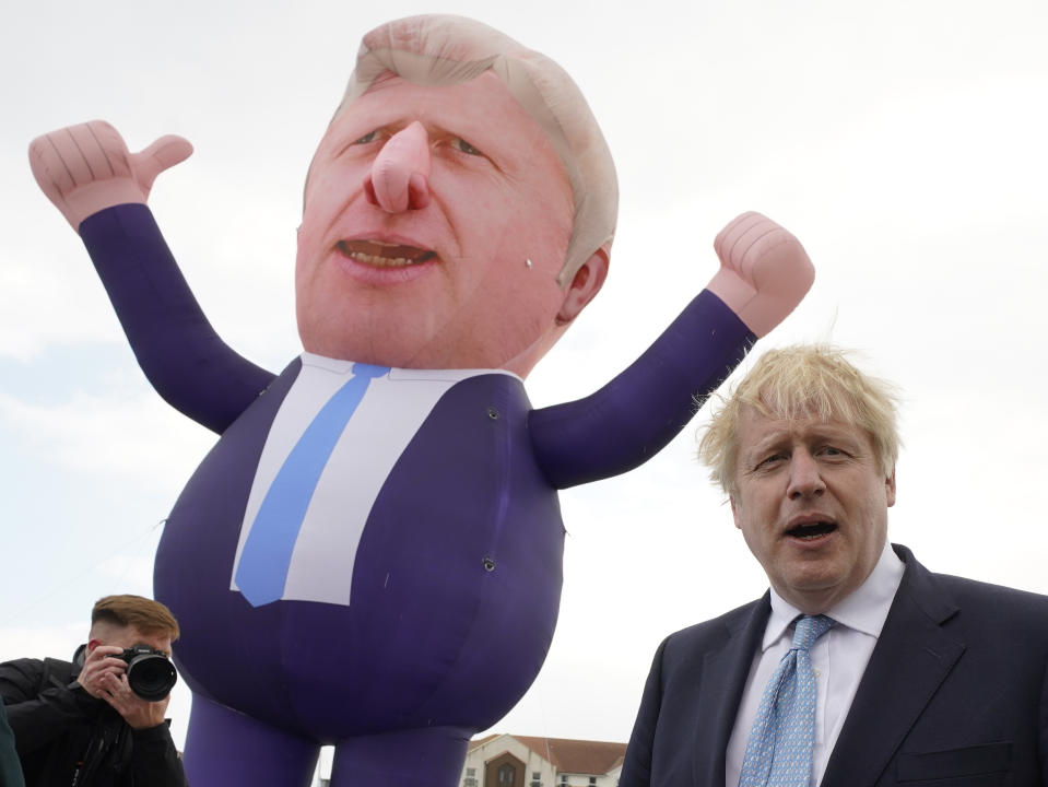 <p>Prime Minister Boris Johnson in front of a giant inflatable of himself as he meets and newly elected MP Jill Mortimer at Jacksons Wharf in Hartlepool, County Durham, following Ms Mortimer's victory in the Hartlepool parliamentary by-election. Picture date: Friday May 7, 2021.</p>
