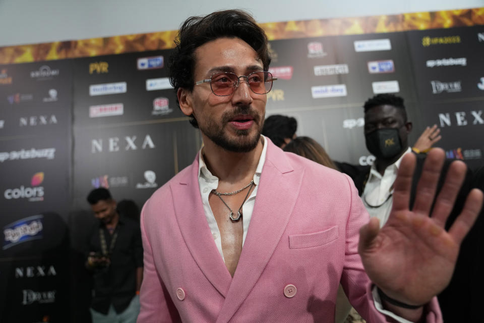 Indian actor Tiger Shroff arrives on the green carpet ahead of the 22nd International Indian Film Academy (IIFA) awards in Abu Dhabi, United Arab Emirates, Friday, June 3, 2021. (AP Photo/Kamran Jebreili)