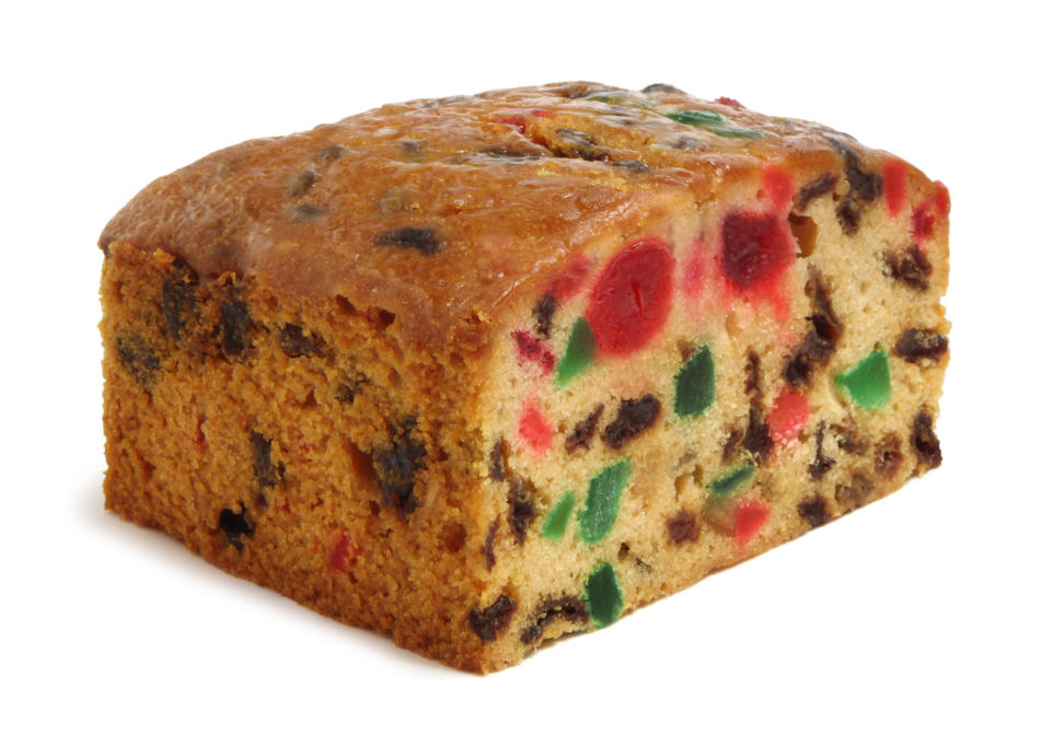 Holiday fruit cake isolated on white