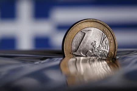 A one Euro coin is seen in this picture illustration taken in Rome, Italy July 9, 2015. REUTERS/Tony Gentile