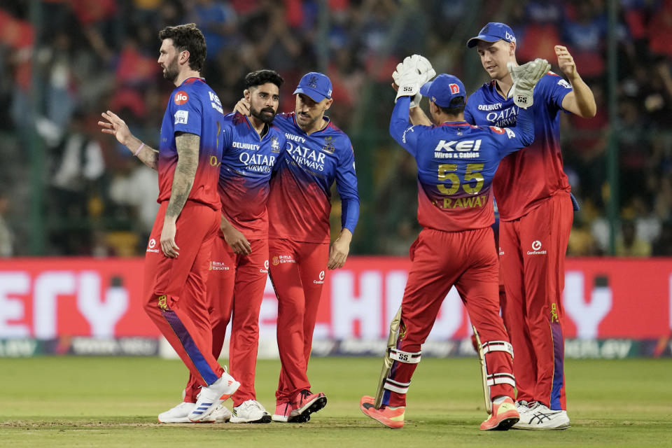 Royal Challengers Bengaluru's Mohammed Siraj, second left, celebrates with teammates the dismissal of Lucknow Super Giants' Devdutt Padikkal during the Indian Premier League cricket match between Royal Challengers Bengaluru and Lucknow Super Giants in Bengaluru, India, Tuesday, April 2, 2024. (AP Photo/Aijaz Rahi)