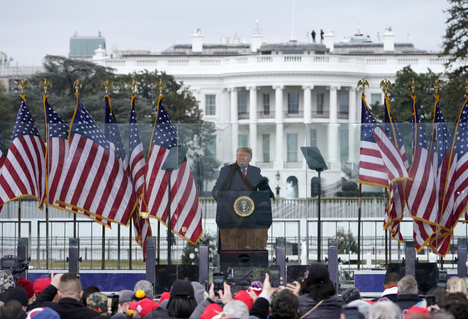 FILE - In this Jan. 6, 2021, file photo with the White House in the background, President Donald Trump speaks at a rally in Washington. The Biden administration will have a big say in whether the government releases information to Congress on the actions of former president Donald Trump and his aides on Jan. 6. But there could be a lengthy court battle before any details come out. (AP Photo/Jacquelyn Martin, File)