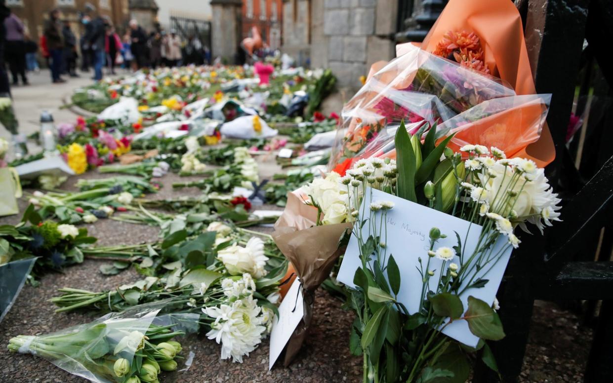 Flowers left outside Windsor Castle for Prince Philip - REUTERS /ANDREW BOYERS 