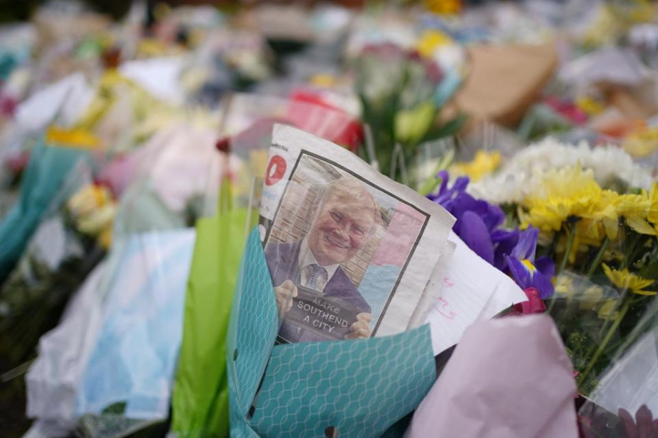 An edition of the Southend Echo tucked into one of the floral tributes left outside the Belfairs Methodist Church in Leigh-on-Sea, Essex, where Conservative MP Sir David Amess was killed on Friday (Joe Giddens/ PA) (PA Wire)