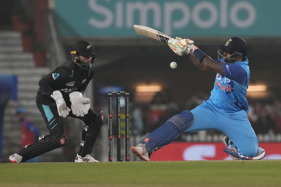 India's Suryakumar Yadav, left, plays a shot during the first Twenty20 cricket match between between India and New Zealand in Ranchi, India, Friday, Jan. 27, 2023. (AP Photo/Bikas Das)