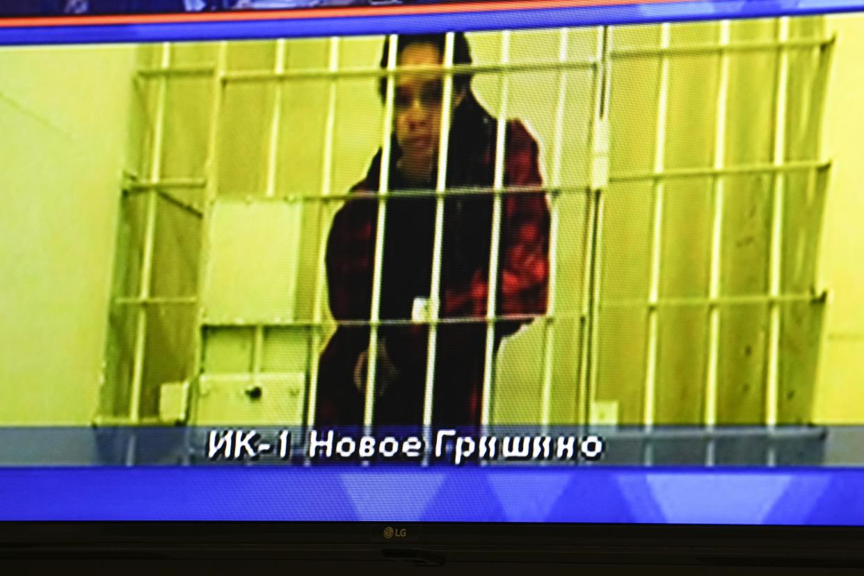 WNBA star and two-time Olympic gold medalist Brittney Griner is seen on the bottom part of a TV screen as she waits to appear in a video link provided by the Russian Federal Penitentiary Service a courtroom prior to a hearing at the Moscow Regional Court in Moscow, Russia, Tuesday, Oct. 25, 2022. A Russian court on Tuesday started hearing American basketball star Brittney Griner's appeal against her nine-year prison sentence for drug possession. (AP Photo/Alexander Zemlianichenko)