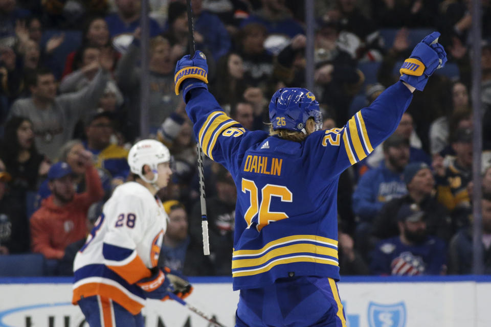 Buffalo Sabres defenseman Rasmus Dahlin (26) reacts after his assist on a goal by Alex Tuch during the second period of the team's NHL hockey game against the New York Islanders on Thursday, Jan. 19, 2023, in Buffalo, N.Y. (AP Photo/Joshua Bessex)