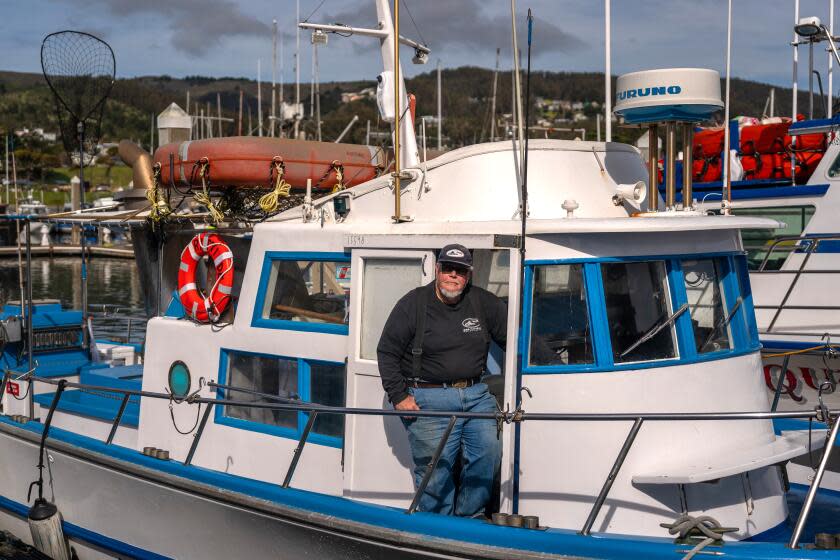 HALF MOON BAY, CALIFORNIA - MARCH 21: Captain William "Smitty" Smith stands for a portrait at Pillar Point Harbor in Half Moon Bay. This year's salmon fishing season, which typically starts in May, is likely to be severely restricted - or possibly canceled for a second straight year. (Loren Elliott / For The Times)