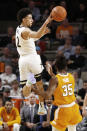 Vanderbilt guard Scotty Pippen Jr. (2) passes the ball over Tennessee guard Yves Pons (35) during the first half of an NCAA college basketball game Saturday, Jan. 18, 2020, in Nashville, Tenn. Tennessee won 66-45. (AP Photo/Mark Humphrey)