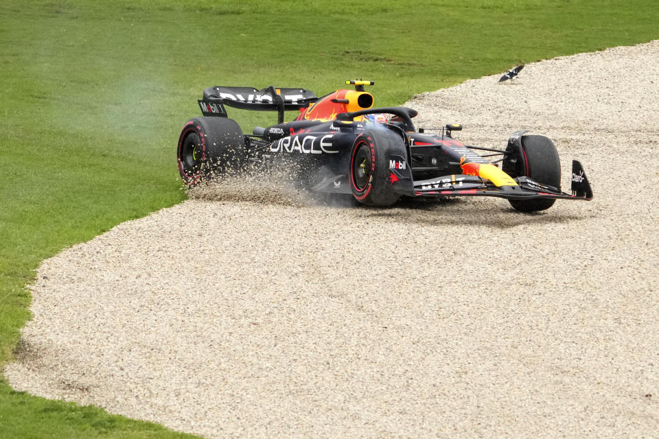 Red Bull driver Sergio Perez of Mexico runs off the track during a practice session ahead of the Australian Formula One Grand Prix at Albert Park in Melbourne, Saturday, April 1, 2023. (AP Photo/Scott Barbour)