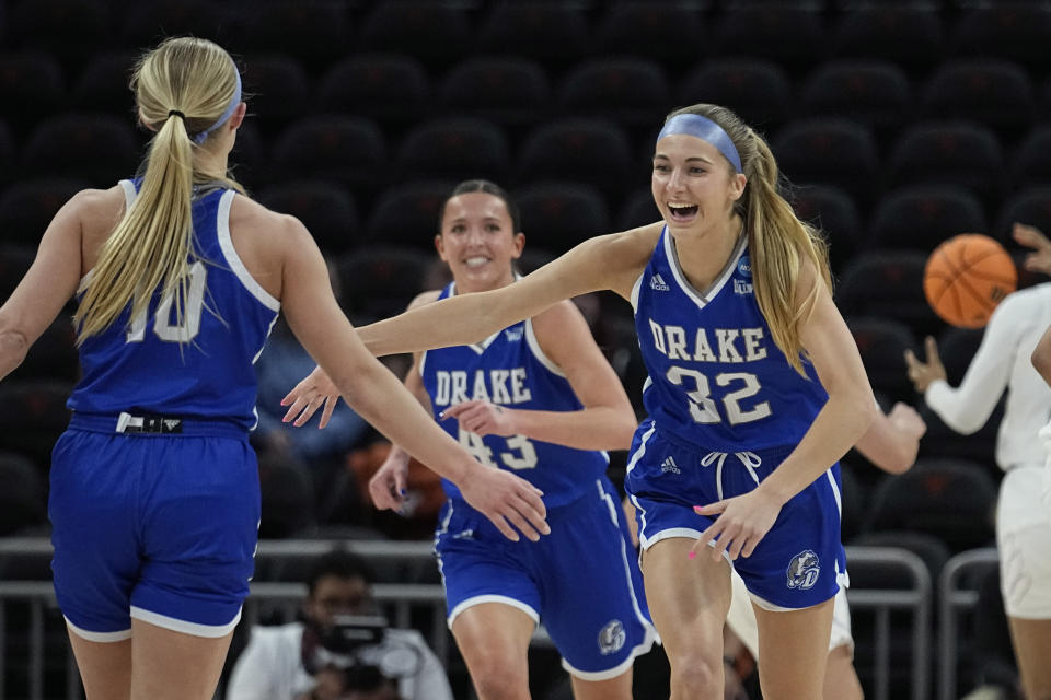 Drake forward Courtney Becker (32) celebrates a scores against Louisville during the first half of a first-round college basketball game in the NCAA Tournament in Austin, Texas, Saturday, March 18, 2023. (AP Photo/Eric Gay)