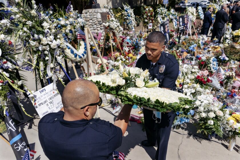 Los Angeles, CA - June 17: Family members of police officers who were killed in the line of duty joined law enforcement officers and Deputy District Attorney Association representatives for a news conference at El Monte's Police Department to pay tribute to the two El Monte officers slain earlier this week.