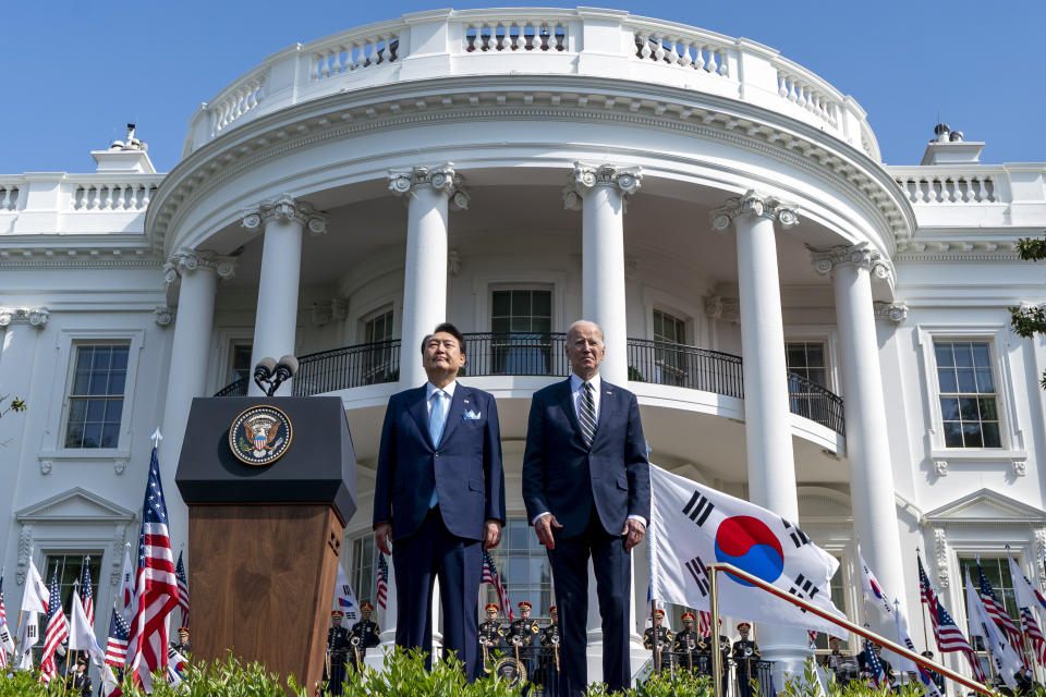 President Joe Biden and South Korea's President Yoon Suk Yeol stand as their two country's national anthems are played during a State Arrival Ceremony on the South Lawn of the White House in Washington, Washington, Wednesday, April 26, 2023. (AP Photo/Andrew Harnik)