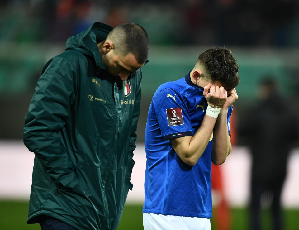 Giorgio Chiellini (pictured left) and Jorginho (pictured right) devastated as they walk off at the end of the 2022 FIFA World Cup Qualifier knockout match.