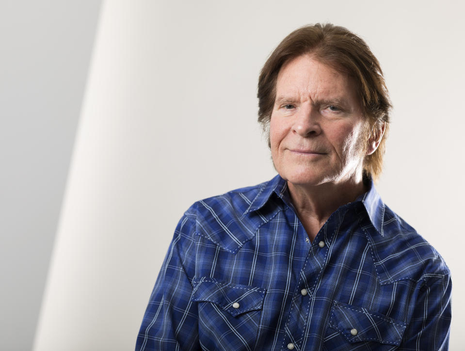 In this Tuesday, Aug. 6, 2019 photo, John Fogerty poses for a photo at an interview with The Associated Press in New York. For the first time, an audio recording is available of nearly everything heard onstage at Woodstock 50 years ago - from transcendent music to announcements about lost people and bad acid. Creedence Clearwater Revival, one of the most popular acts at the time, had never before authorized release of their performance. Fifty years later, the set is now available both on the Rhino Records box and a separate disc okayed by Fogerty. (Photo by Brian Ach/Invision/AP)