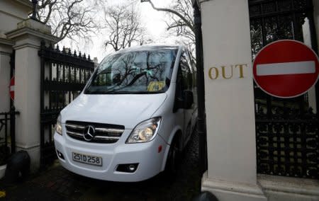 A bus carrying embassy staff and children leave Russia's Embassy in London, Britain, March 20, 2018. REUTERS/Toby Melville