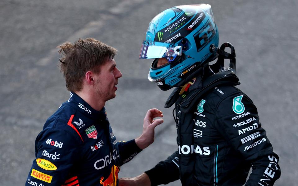 Third placed Max Verstappen of the Netherlands and Oracle Red Bull Racing and 4th placed George Russell of Great Britain and Mercedes talk in parc ferme during the Sprint ahead of the F1 Grand Prix of Azerbaijan at Baku City Circuit on April 29, 2023 in Baku, Azerbaijan. - Bryn Lennon/Getty Images