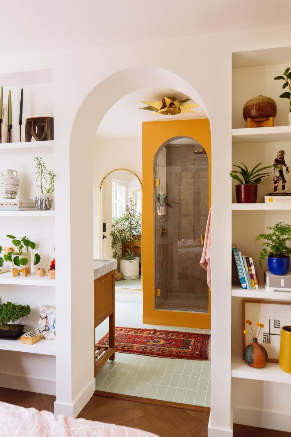 remodeled bathroom with yellow arched shower door