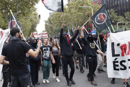 Protestors take part in an anti-fascist demonstration on Spain's National Day in Barcelona, Spain October 12, 2018. REUTERS/Albert Gea