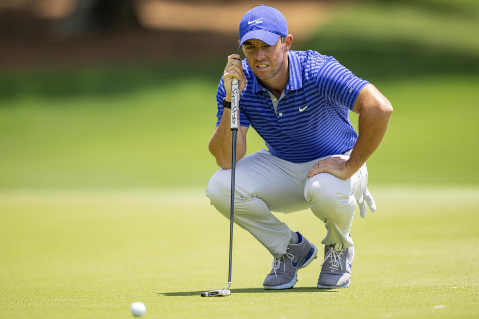 Rory McIlroy lines up his putt on the third hole during the first round of the Wells Fargo Championship golf tournament at Quail Hollow Club on Thursday, May 6, 2021, in Charlotte, N.C. (AP Photo/Jacob Kupferman)