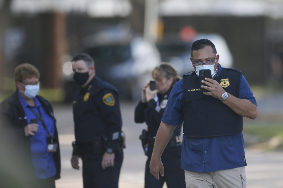 Houston Police chief Art Acevedo walks on the scene of an officer-involved shooting at an apartment complex on Tuesday, Oct. 20, 2020, in Houston. Two Houston officers were shot before a SWAT team was dispatched to the scene, where the suspected shooter was arrested, authorities said. (Godofredo A. Vásquez / Houston Chronicle via AP)