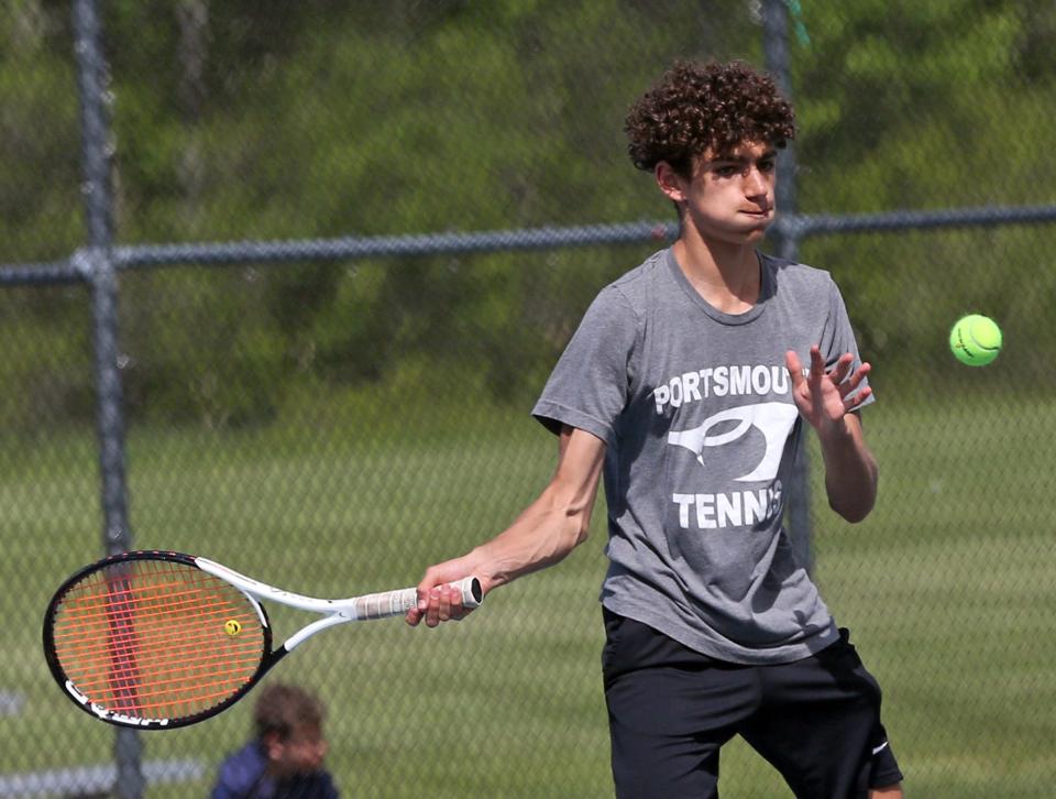 Portsmouth's Raphael Hey Tenne returns a serve from Oyster River's Ben Montgomery in their No. 2 singles match during Thursday's Division II quarterfinal.