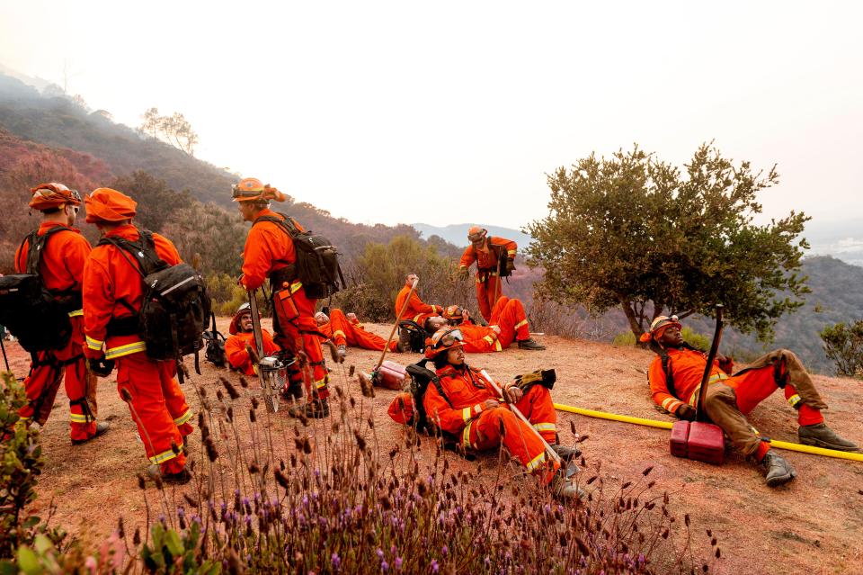 Inmate firefighters rest during a break from battling the River Fire in Salinas, Calif., on Aug. 17.