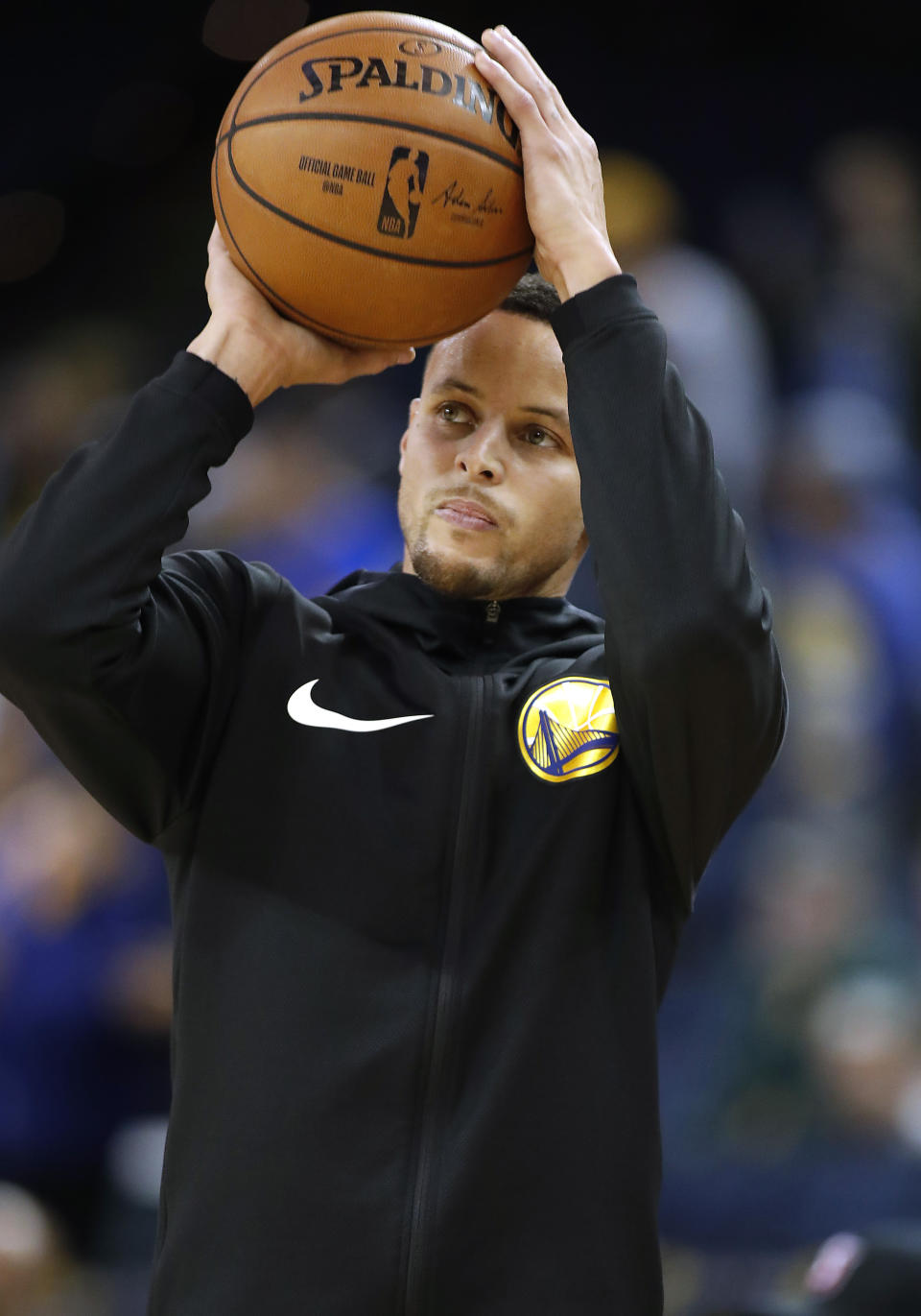 Golden State Warriors guard Stephen Curry warms up before the team's NBA basketball game against the Portland Trail Blazers in Oakland, Calif., Friday, Nov. 23, 2018. (AP Photo/Tony Avelar)
