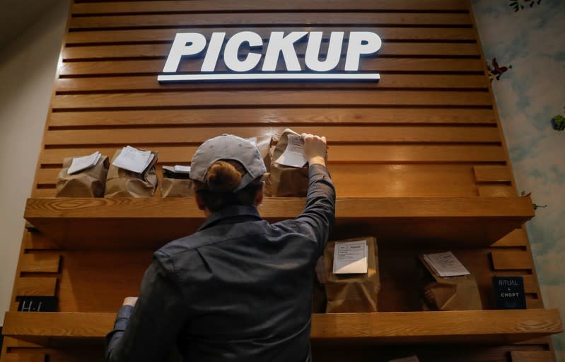 A worker sets out orders for pickup at a Chopt Creative Salad Co., location in New York