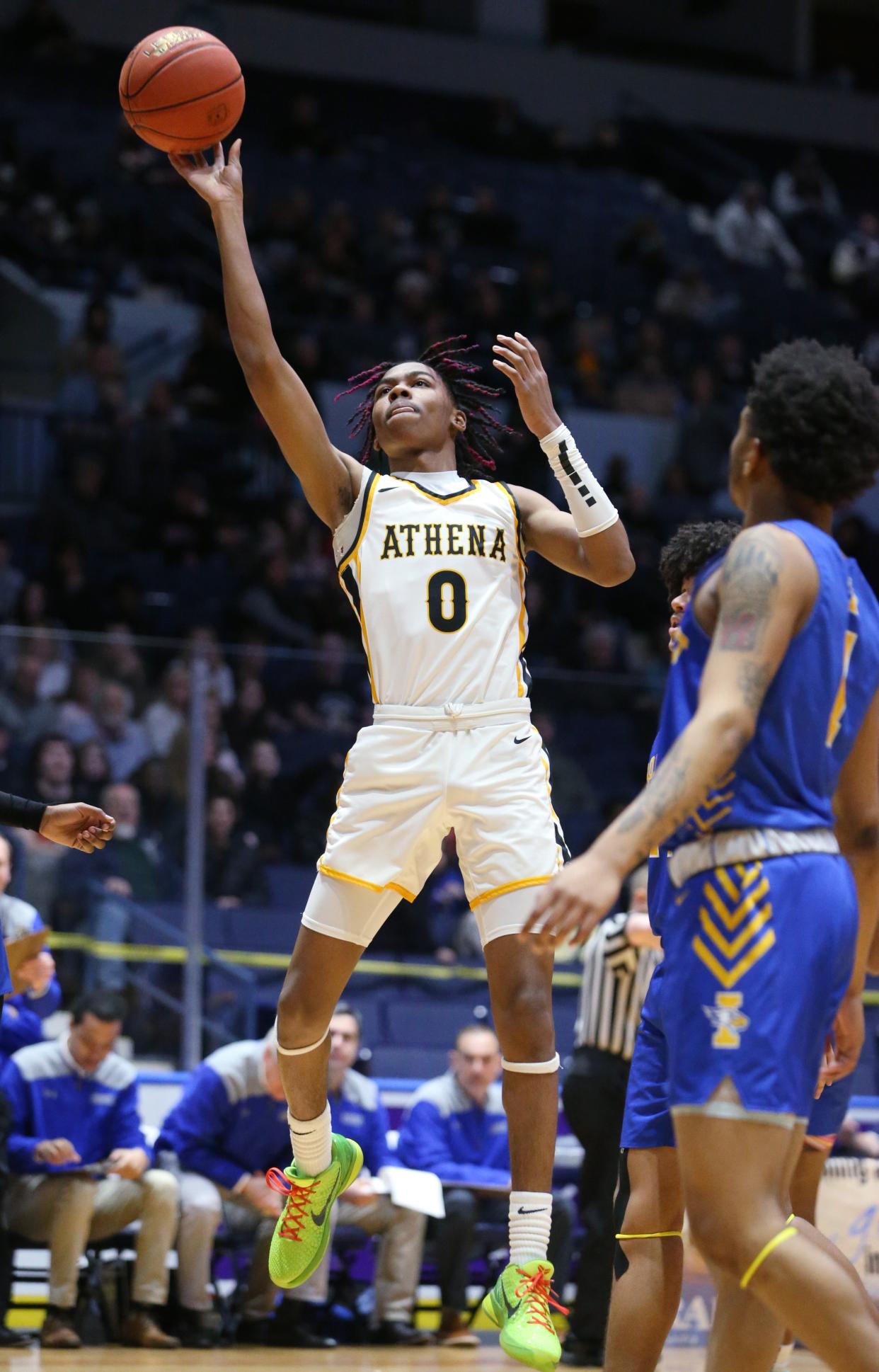 Athena's I'zick Reaves drives in to score in the first quarter during their Class A1 Championship final Saturday, March 4, 2023 a the Blue Cross Arena.