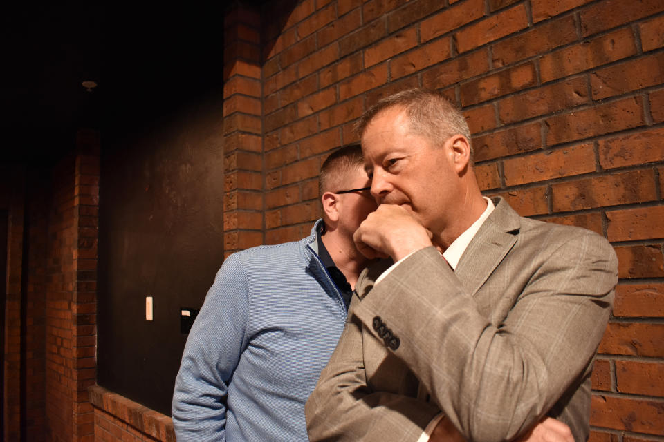 Montana U.S. House candidate and former state Sen. Al Olszewski, right, talks with campaign aide Drew Zinecker during an event hosted by Butte-Silver Bow County Republicans at the Copper King Hotel and Convention Center, May 13, 2022, in Butte, Montana. Olszewski has criticized his primary opponent, former Trump cabinet member Ryan Zinke, as being too liberal for a newly-created House district in western Montana. (AP Photo/Matthew Brown)