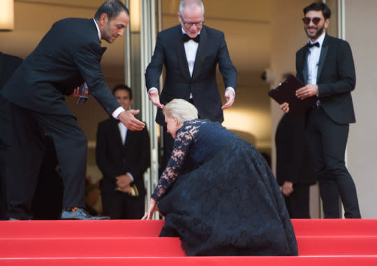 Helen Mirren stumbles on the stairs on the red carpet at Cannes. (Photo: Getty Images)