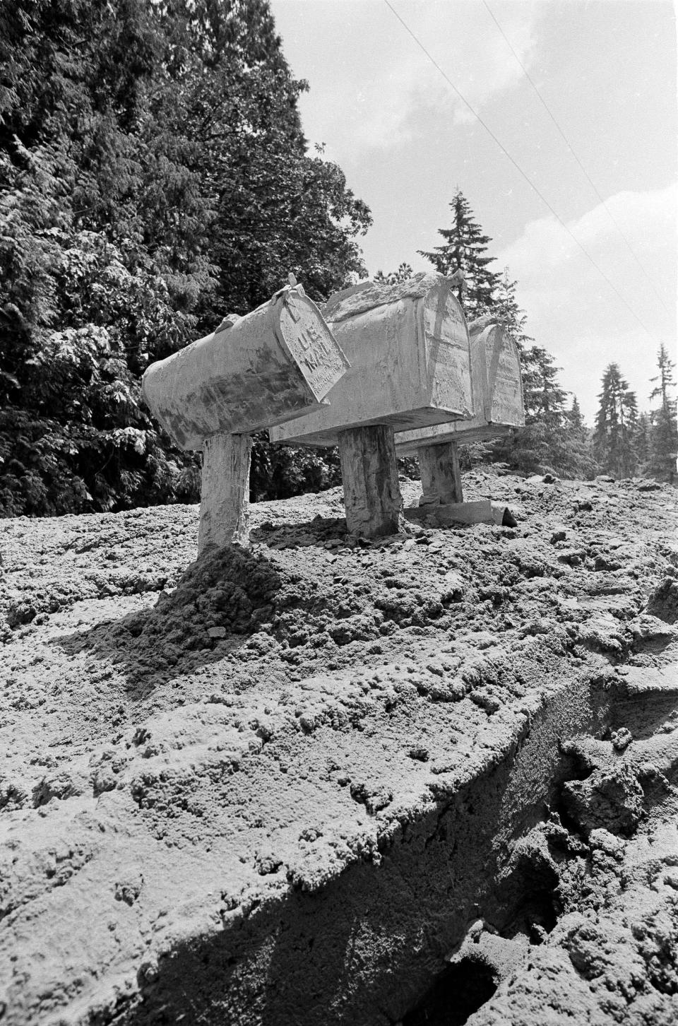 Mud from the Toutle River rises about four feet in this area of Toutle as residents started digging out, May 31, 1980, after the area was hit by flash flooding in the wake of the May 18 eruptions on Mount St. Helens.