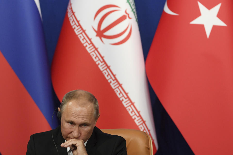 Russia's President Vladimir Putin, attends a news conference following the Russia-Iran-Turkey summit in Iran on Friday Sept. 7, 2018. Putin, Erdogan and Iran's President Hassan Rouhani began a meeting Friday in Tehran to discuss the war in Syria, with all eyes on a possible military offensive to retake the last rebel-held bastion of Idlib. (Kirill Kudryavtsev/Pool Photo via AP)