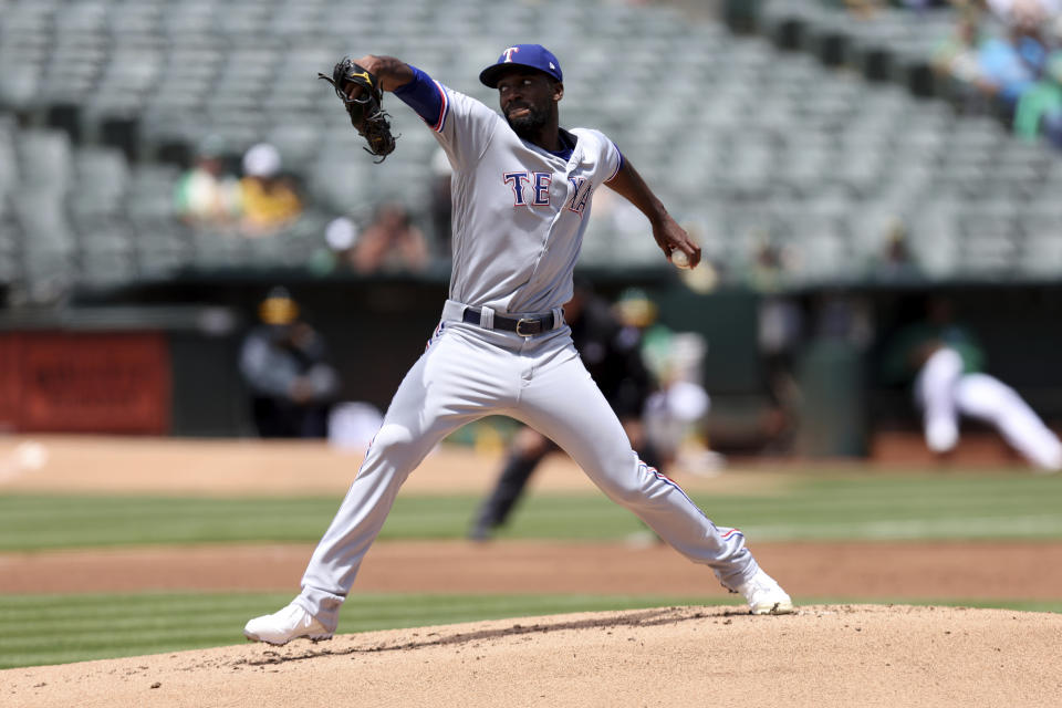 Texas Rangers' Taylor Hearn pitches against the Oakland Athletics during the first inning of a baseball game in Oakland, Calif., Saturday, May 28, 2022. (AP Photo/Jed Jacobsohn)