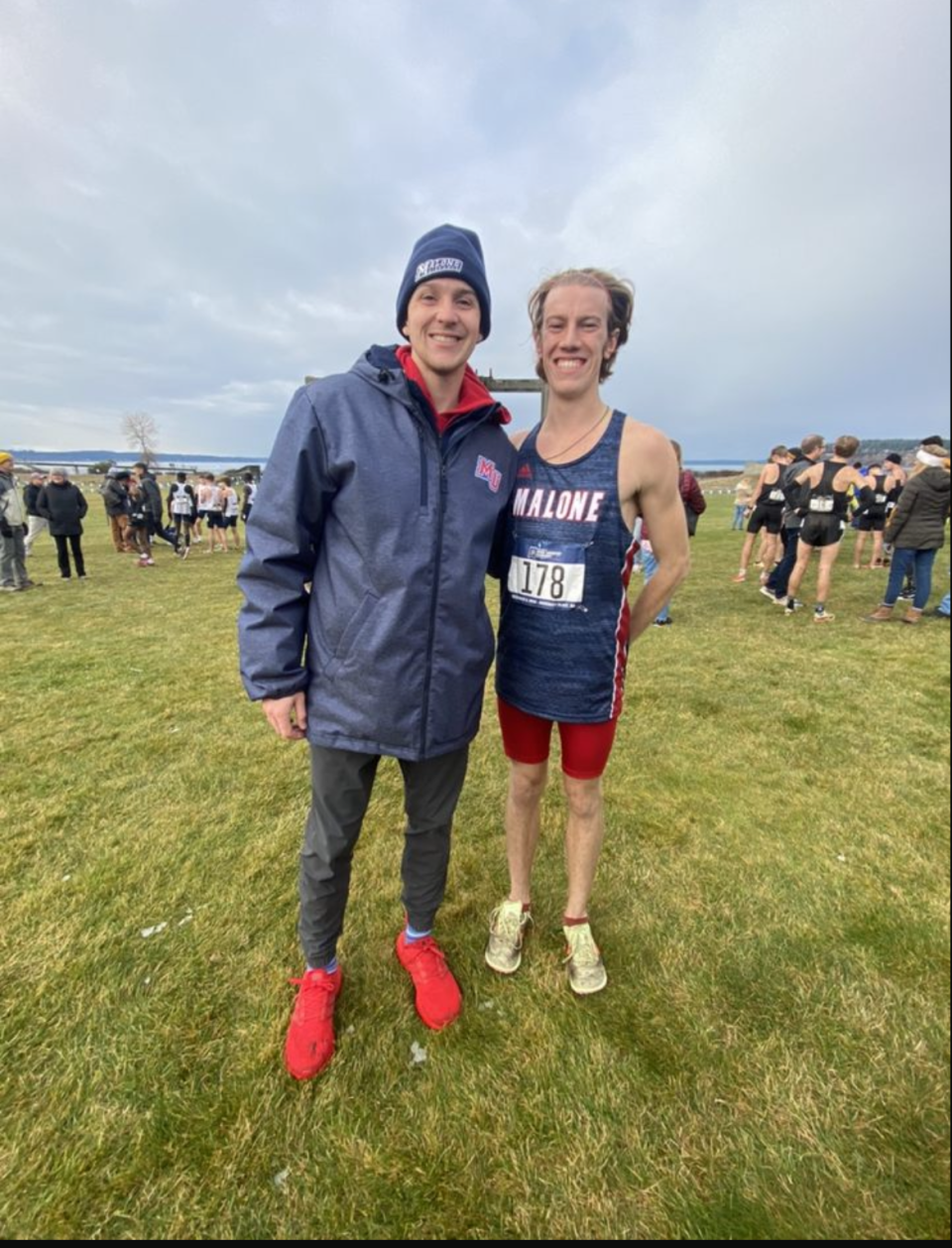 Max Gucker (right) is pictured with Malone men's cross country head coach Noah Schaub.