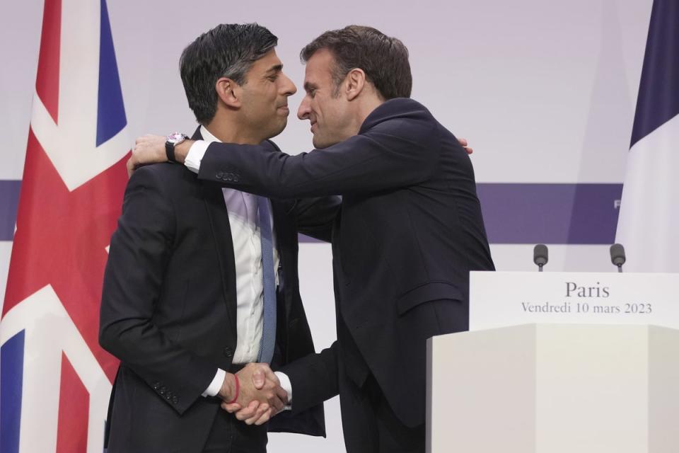 Prime Minister Rishi Sunak and President Emmanuel Macron embrace (Kin Cheung/PA) (PA Wire)