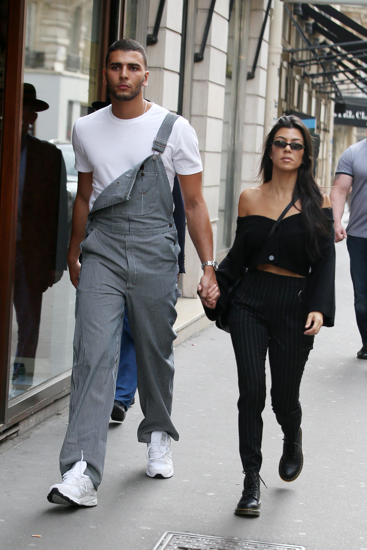 Younes Bendjima and Kourtney Kardashian take a stroll around Paris in September 2017. (Photo: Shutterstock)