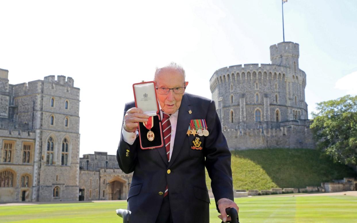 Fundraising UK veteran Sir Captain Tom Moore receives knighthood from the Queen at Windsor Castle - Chris Jackson/Reuters