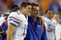 FILE - In this Nov. 1, 2008, file photo, Florida quarterback Tim Tebow, left, and coach Urban Meyer celebrate in the fourth quarter during an NCAA college football game against Georgia in Jacksonville, Fla. Tebow and Meyer are together again, this time in the NFL and with Tebow playing a new position. The former Florida star and 2007 Heisman Trophy-winning quarterback signed a one-year contract with the Jacksonville Jaguars on Thursday, May 20, 2021, and will attempt to revive his pro career as a tight end. (AP Photo/Stephen Morton, File)