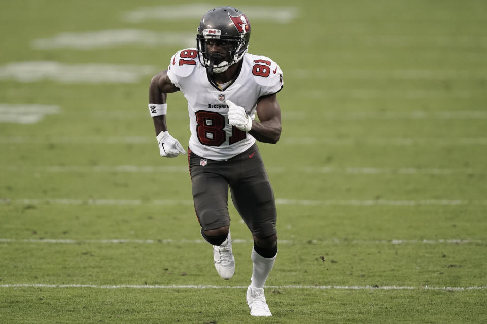 Tampa Bay Buccaneers wide receiver Antonio Brown (81) runs a route against the Carolina Panthers during the second half of an NFL football game, Sunday, Nov. 15, 2020, in Charlotte , N.C. (AP Photo/Gerry Broome)