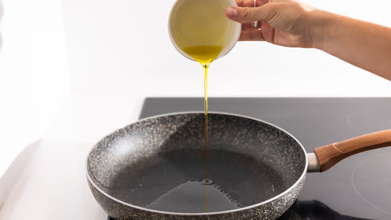 olive oil going into pan 