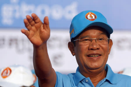 President of the Cambodian People's Party (CPP) and Cambodia's Prime Minister Hun Sen weaves to his supporters during campaign on final day in Phnom Penh, Cambodia, July 27, 2018. REUTERS/Samrang Pring